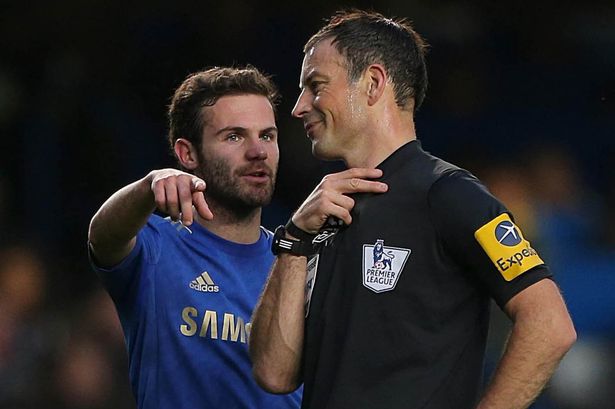 Juan Mata argues with referee Mark Clattenburg.jpg